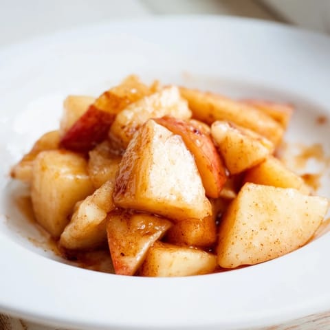 Warm, cinnamon-infused Slow Cooker Stewed Apples creating a delicious breakfast topping or dessert.