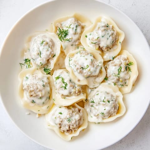 Golden-brown, perfectly cooked Russian pelmeni, offering a savory bite, ready to be enjoyed.
