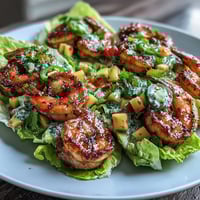 Lightened-Up Mango Salsa Shrimp Lettuce Tacos with juicy shrimp and fresh mango salsa in crisp lettuce cups.